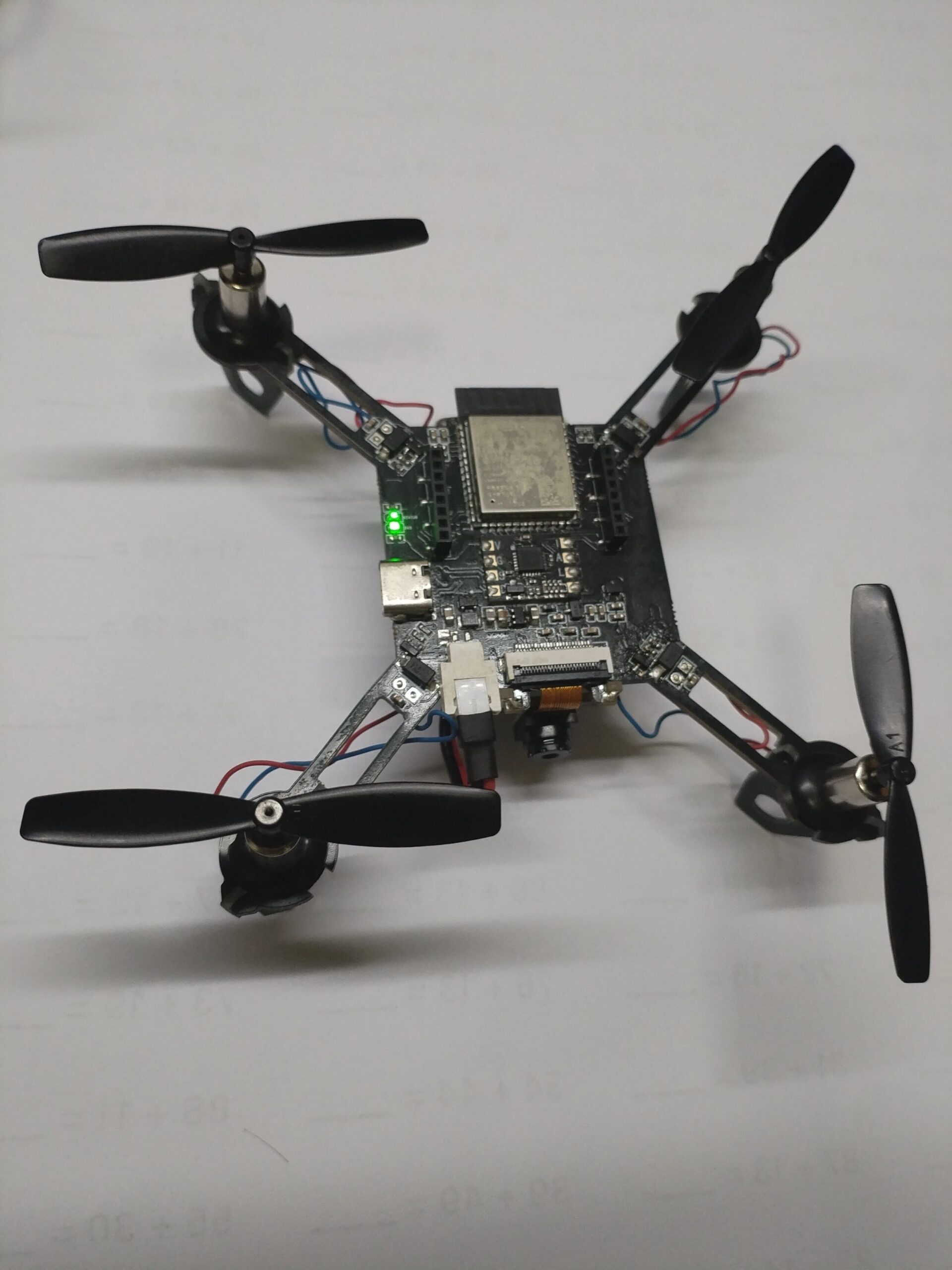 Top view of the micro drone with the ESP32 module and status LED visible